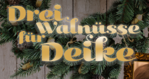In goldener Schrift steht "Drei Walnüsse für Deine" vor grünen Tannenzweigen.
